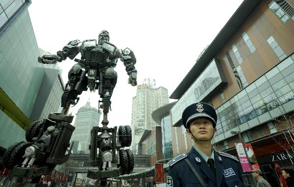 A transformer model featuring legendary Chinese general Guan Yu towers up on a street in downtown Shenyang, northeast China's Liaoning Province, April 20, 2011. 