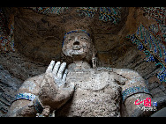 The Yungang Grottoes, with a history of more than 1,500 years, is one of the largest cave clusters in China. Located in the north cliff of Wuzhou Mountain, Datong, the grottoes, composed of 53 caves and over 51,000 stone statues, represent the Chinese Buddhist cave art from the period of 460-525 AD. It also encompasses Indian Buddhist art, Greek and Roman architectural characteristics, indicating ancient China's cultural exchange and relationship with diverse world civilizations.[China.org.cn]