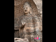 The Yungang Grottoes, with a history of more than 1,500 years, is one of the largest cave clusters in China. Located in the north cliff of Wuzhou Mountain, Datong, the grottoes, composed of 53 caves and over 51,000 stone statues, represent the Chinese Buddhist cave art from the period of 460-525 AD. It also encompasses Indian Buddhist art, Greek and Roman architectural characteristics, indicating ancient China's cultural exchange and relationship with diverse world civilizations.[China.org.cn]