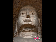 The Yungang Grottoes, with a history of more than 1,500 years, is one of the largest cave clusters in China. Located in the north cliff of Wuzhou Mountain, Datong, the grottoes, composed of 53 caves and over 51,000 stone statues, represent the Chinese Buddhist cave art from the period of 460-525 AD. It also encompasses Indian Buddhist art, Greek and Roman architectural characteristics, indicating ancient China's cultural exchange and relationship with diverse world civilizations.[China.org.cn]