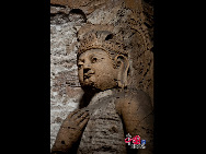 The Yungang Grottoes, with a history of more than 1,500 years, is one of the largest cave clusters in China. Located in the north cliff of Wuzhou Mountain, Datong, the grottoes, composed of 53 caves and over 51,000 stone statues, represent the Chinese Buddhist cave art from the period of 460-525 AD. It also encompasses Indian Buddhist art, Greek and Roman architectural characteristics, indicating ancient China's cultural exchange and relationship with diverse world civilizations.[China.org.cn]