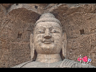 The Yungang Grottoes, with a history of more than 1,500 years, is one of the largest cave clusters in China. Located in the north cliff of Wuzhou Mountain, Datong, the grottoes, composed of 53 caves and over 51,000 stone statues, represent the Chinese Buddhist cave art from the period of 460-525 AD. It also encompasses Indian Buddhist art, Greek and Roman architectural characteristics, indicating ancient China's cultural exchange and relationship with diverse world civilizations.[China.org.cn]
