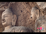 The Yungang Grottoes, with a history of more than 1,500 years, is one of the largest cave clusters in China. Located in the north cliff of Wuzhou Mountain, Datong, the grottoes, composed of 53 caves and over 51,000 stone statues, represent the Chinese Buddhist cave art from the period of 460-525 AD. It also encompasses Indian Buddhist art, Greek and Roman architectural characteristics, indicating ancient China's cultural exchange and relationship with diverse world civilizations.[China.org.cn]
