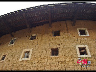 Photo shows the Tianluokeng Tulou, earth buildings in Chinese, in Nanjing County, southeast China's Fujian Province. Built on a base of stone, the thick walls of Tulou were packed with dirt and fortified with wood or bamboo internally. The architectural arts of the Fujian Tulou can be traced back nearly 1,000 years, and their design incorporates the tradition of fengshui (favorable siting within the environment). [China.org.cn] 