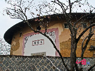 Photo shows the Tianluokeng Tulou, earth buildings in Chinese, in Nanjing County, southeast China's Fujian Province. Built on a base of stone, the thick walls of Tulou were packed with dirt and fortified with wood or bamboo internally. The architectural arts of the Fujian Tulou can be traced back nearly 1,000 years, and their design incorporates the tradition of fengshui (favorable siting within the environment). [China.org.cn] 