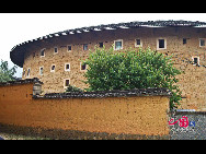Photo shows the Tianluokeng Tulou, earth buildings in Chinese, in Nanjing County, southeast China's Fujian Province. Built on a base of stone, the thick walls of Tulou were packed with dirt and fortified with wood or bamboo internally. The architectural arts of the Fujian Tulou can be traced back nearly 1,000 years, and their design incorporates the tradition of fengshui (favorable siting within the environment). [China.org.cn] 