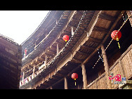 Photo shows the Tianluokeng Tulou, earth buildings in Chinese, in Nanjing County, southeast China's Fujian Province. Built on a base of stone, the thick walls of Tulou were packed with dirt and fortified with wood or bamboo internally. The architectural arts of the Fujian Tulou can be traced back nearly 1,000 years, and their design incorporates the tradition of fengshui (favorable siting within the environment). [China.org.cn] 