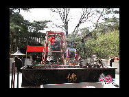 The Pool and Cudrania Temple, or Tanzhe Si, is situated 45 kilometers west of the city. The Chinese have a centuries old proverb; 'First there was the Pool and Cudrania Temple, then came Beijing.' This structure dates back 1,600 years to the Jin Dynasty, when it was known as the Temple of Auspicious Fortune. During the Tang Dynasty the grounds were expanded and renamed the Dragon Spring Temple. [China.org.cn]