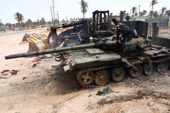 Tanks and other military vehicles abandoned by pro-Gaddafi troops are seen in Misrata, Libya, April 22, 2011. Misrata is the only major city in western Libya still under control of opposition forces. [Xinhua] 