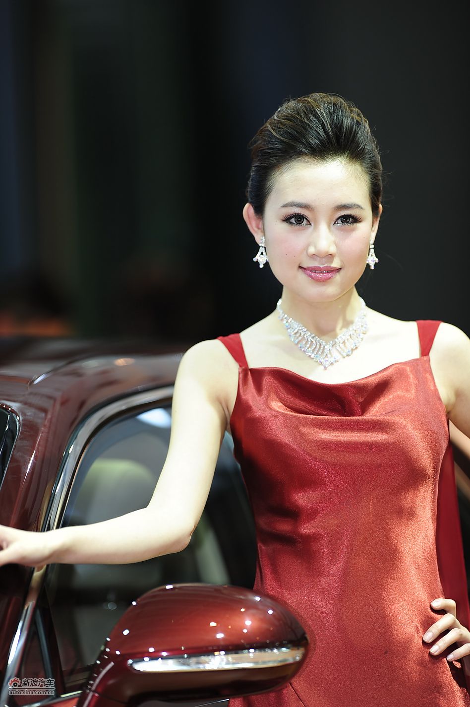 Model poses for Changan PSA at Auto Shanghai 2011, the 14th Shanghai International Automobile Industry Exhibition, which opens in the city&apos;s new International Expo Center from April 19-28. [Sina]