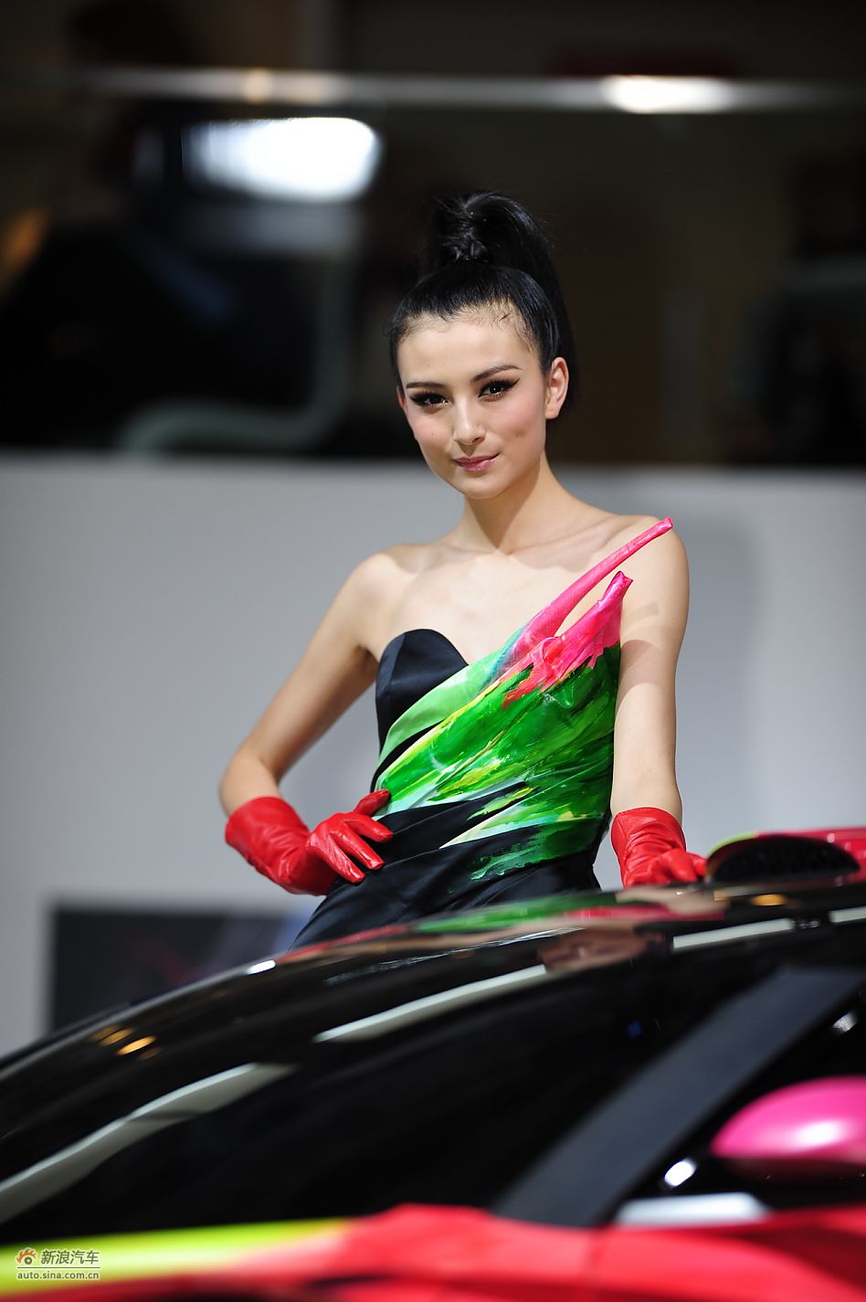 Model poses for Changan PSA at Auto Shanghai 2011, the 14th Shanghai International Automobile Industry Exhibition, which opens in the city&apos;s new International Expo Center from April 19-28. [Sina]