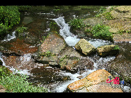 Zhangjiajie of Hunan Province is marked with world-famous Sandstone Peak Forest Geopark, where more than 3,000 sandstone peaks erected high in the clouds are very unique in the world. [China.org.cn]
