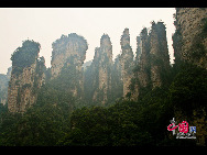 Zhangjiajie of Hunan Province is marked with world-famous Sandstone Peak Forest Geopark, where more than 3,000 sandstone peaks erected high in the clouds are very unique in the world. [China.org.cn]