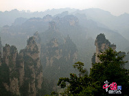 Zhangjiajie of Hunan Province is marked with world-famous Sandstone Peak Forest Geopark, where more than 3,000 sandstone peaks erected high in the clouds are very unique in the world. [China.org.cn]
