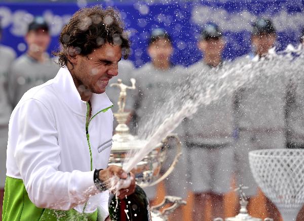 Spanish Rafael Nadal sprays cava after winning the final match of the Barcelona Open tennis tournament against compatriot David Ferrer in Barcelona. Nadal won 6-2, 6-4. (Xinhua/AFP Photo) 