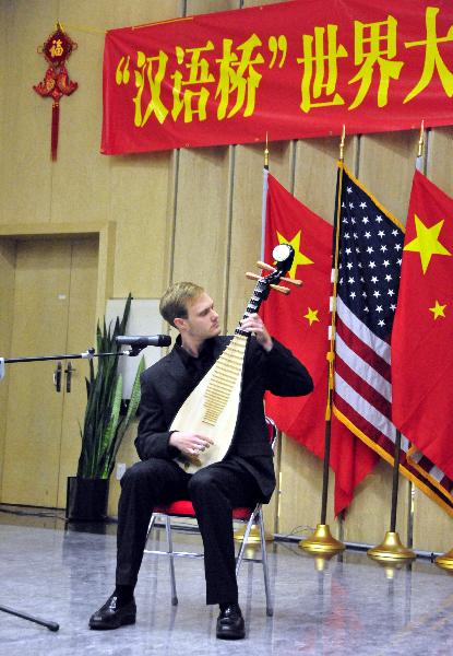 Dylan Parmenter performs during the 'Chinese Bridge' Southern American College and Middle School Students Chinese Language Contest in Houston, the United States, April 24, 2011.