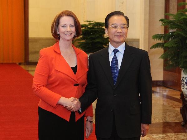 Chinese Premier Wen Jiabao (R) shakes hands with Australian Prime Minister Julia Gillard during a welcome ceremony in Beijing, capital of China, April 26, 2011. [Ding Lin/Xinhua]