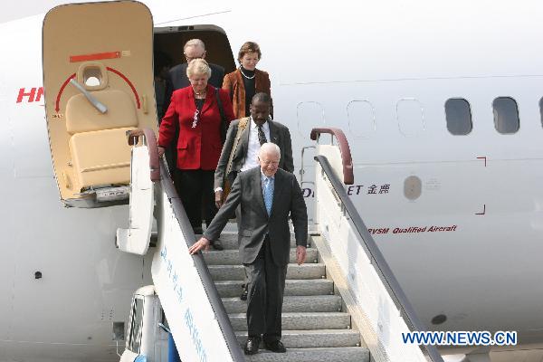 Former U.S. President Jimmy Carter (Front) arrives at the airport of Pyongyang, capital of the Democratic People's Republic of Korea (DPRK), April 26, 2011. Carter arrived in Pyongyang for a three-day visit at easing tensions on the Korean Peninsula. [Zhao Zhan/Xinhua]