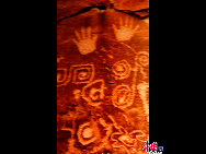 Ningxia Museum presents a special exhibition on the cliff carvings in Helan Mountains, which boast to be a carved history of ancient Chinese nomads, who lived and hunted some 10,000 years ago near Helan Mountains, 56 kilometers from Yinchuan. Most of them were discovered at the entrance to the Mountains, recording the scenes of nomadic life, sacrifice to gods, animals and human images. [Elaine Duan/China.org.cn] 