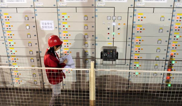 An engineer works at the underground powerhouse of the Three Gorges in Yichang, Central China's Hubei province, April 26, 2011.