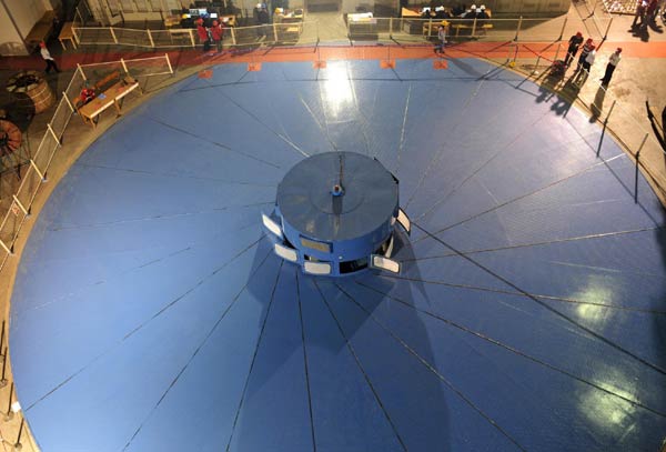 Engineers work at an underground generator of the Three Gorges Project, the No 32 turbine in Yichang, Central China's Hubei province, April 26, 2011.