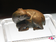 A sleeping copper sheep inlaid with gold and silver unearthed in Ningxia Hui Autonomous Region. As one of the cradles of Chinese ancient civilization, Ningxia witnessed human activities as far back as some 30,000 years. [Elaine Duan/China.org.cn]