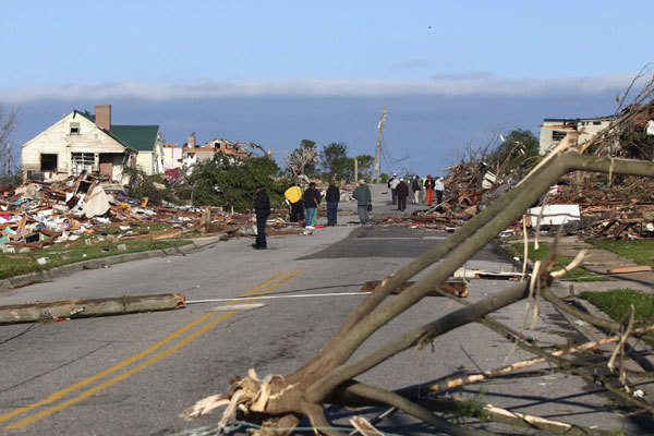 Residents inspect the aftermath of overnight tornadoes that left this part of Pratt City, a suburb of Birmingham, Alabama, in ruins April 28, 2011. 