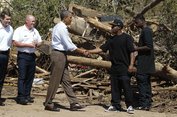 U.S. President Barack Obama looks at damage caused by devastating severe storms and tornadoes in the Tuscaloosa, Alabama, area, April 29, 2011. [Xinhua/Reuters Photo]