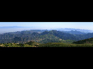 Crowned as the highest mountain in outskirts of Beijing, Lingshan Mountain has an average temperature of 12 degrees Celsius lower than downtown Beijing. And the top of the mountain is covered with snow all year round. Despite the extreme summer heat in downtown Beijing, Lingshan Mountain has its springtime now. Meadows thrive with green grass, languid white sheep wander across the meadow, and you can see outlines of distant mountains in the clear sky.[奔牛牛/forums.nphoto.net]