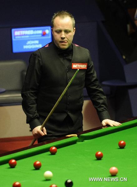 John Higgins of Scotland plays during his final match against Judd Trump of England in 2011's World Snooker Championship in Sheffield, Britain, May 2, 2011. Higgins won 18-15 to claim the title for the fourth time. (Xinhua/Zeng Yi) 