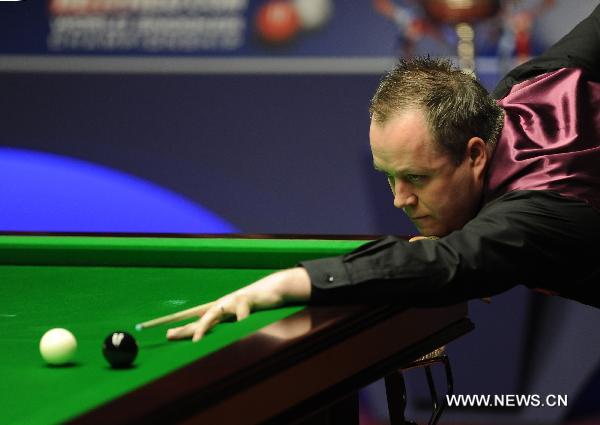 John Higgins of Scotland plays during his final match against Judd Trump of England in 2011's World Snooker Championship in Sheffield, Britain, May 2, 2011. Higgins won 18-15 to claim the title for the fourth time. (Xinhua/Zeng Yi) 