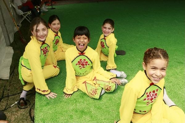 Kids take a rest before performing traditional Chinese dances at the 2011 Houston International Festival in Houston, the United States, April 30, 2011.