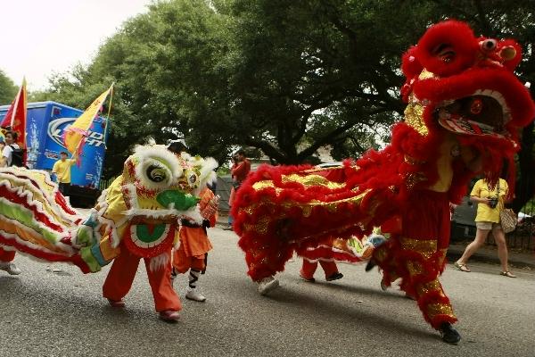 A lion dance performance team take part in the 2011 Houston International Festival in Houston, the United States, April 30, 2011. 