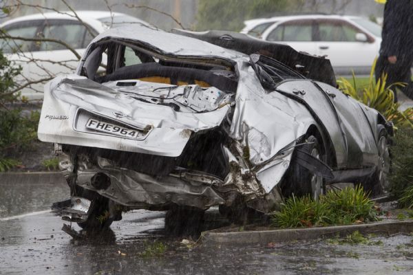 A car is damaged during a tornado in Albany, North Auckland, New Zealand, May 3, 2011. At least two people have died and more than 20 people were injured after a freak tornado ripped through a shopping mall in the north of New Zealand's largest city of Auckland Tuesday. (Xinhua/NZPA/David Rowland) 