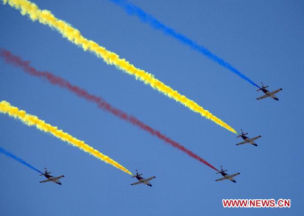 This Oct 1, 2009 file photo shows K8 trainer planes, made by Hongdu Aviation Industry Group, fly in the celebrations for the 60th anniversary of the founding of the People's Republic of China, in Beijing. [