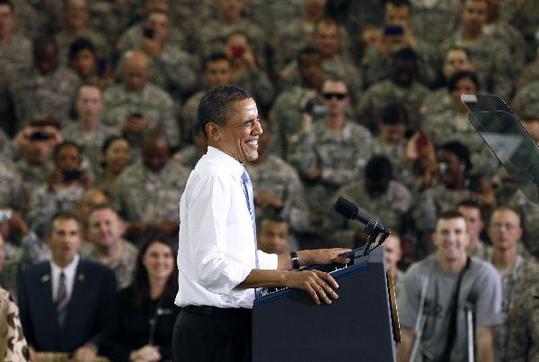 U.S. President Barack Obama smiles as he arrives to speak to troops at Fort Campbell in Kentucky May 6, 2011. Obama addressed several military units that have recently returned from duty in Afghanistan. Also during his visit, Obama privately thanked some members of the elite special forces team involved in the raid that killed Osama bin Laden. [Xinhua/Reuters]