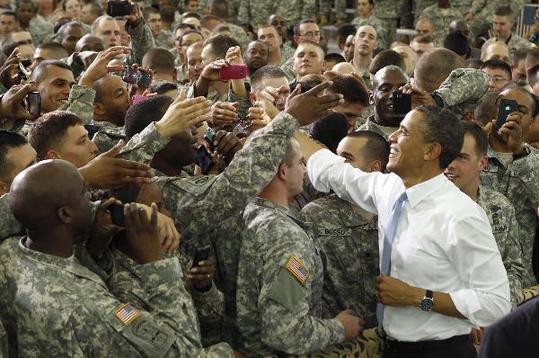 U.S. President Barack Obama greets troops at Fort Campbell in Kentucky May 6, 2011. Obama addressed several military units that have recently returned from duty in Afghanistan. Also during his visit, Obama privately thanked some members of the elite special forces team involved in the raid that killed Osama bin Laden. [Xinhua/Reuters]