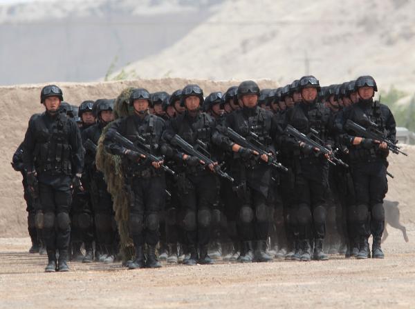 Members of armed police force take part in a joint anti-terror drill in Kaxgar, northwest China's Xinjiang Uygur Autonomous Region, May 6, 2011. China, Kyrgyzstan and Tajikistan, all member states of the Shanghai Cooperation Organization (SCO), Friday conducted a joint anti-terror drill in Xinjiang, according to a statement issued by China's Ministry of Public Security. 