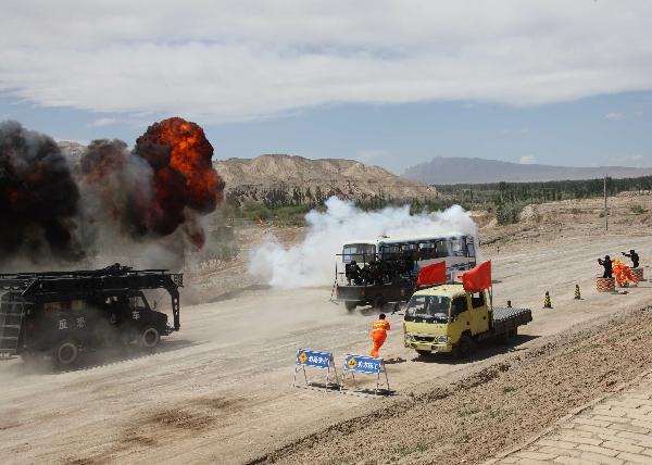 Members of armed police force take part in a joint anti-terror drill in Kaxgar, northwest China's Xinjiang Uygur Autonomous Region, May 6, 2011. China, Kyrgyzstan and Tajikistan, all member states of the Shanghai Cooperation Organization (SCO), Friday conducted a joint anti-terror drill in Xinjiang, according to a statement issued by China's Ministry of Public Security. 