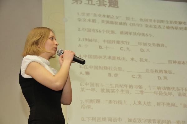 A contestant answers questions during the final of the 10th 'Chinese Bridge' Chinese Proficiency Competition for Foreign College Students in Moscow, capital of Russia, on May 6, 2011. The 10th 'Chinese Bridge' Chinese Proficiency Competition for Foreign College Students in Moscow concluded here Friday. [Zhao Danwen/Xinhua]