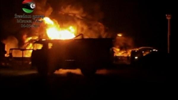 In this amateur video a fuel depot goes up in flames, in Misrata, Libya, Saturday, May 7, 2011. Moammar Gadhafi's forces rocketed the main fuel depot in Misrata on Saturday, intensifying a two-month siege on the rebel-held city that has claimed civilian lives and prompted warnings of a humanitarian crisis.