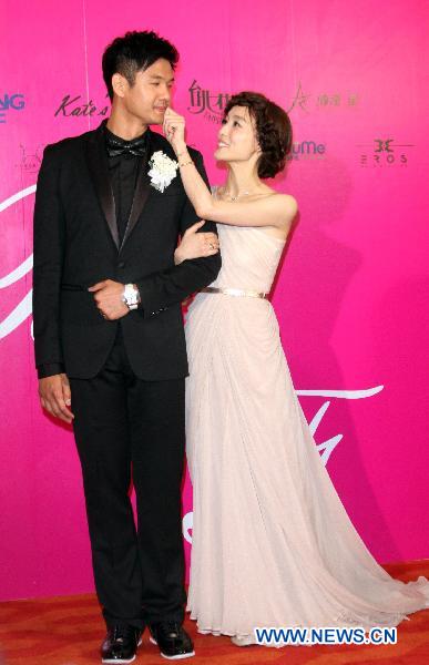 Christine Fan and her husband Charles Chen are seen at their wedding banquet in W Hotel in Taipei, southeast China's Taiwan, May 7, 2011. 