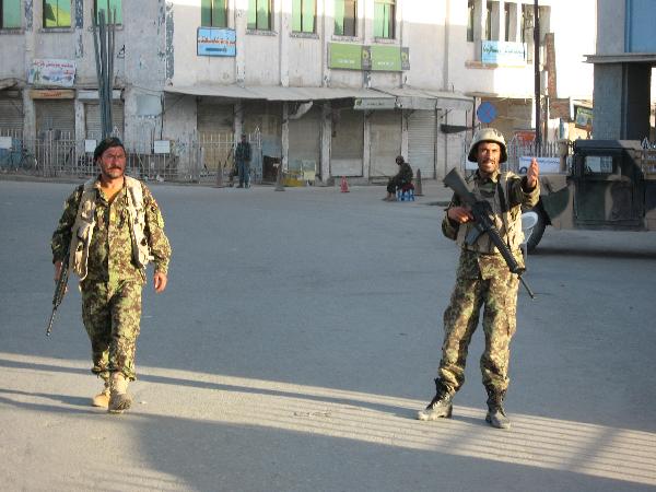 Afghan soldiers stand guard at the attack site in Kandahar province, southern Afghanistan, May 7, 2011. [Xinhua]