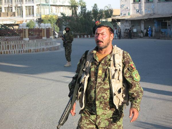 An Afghan soldier stands guard at the attack site in Kandahar province, southern Afghanistan, May 7, 2011. [Xinhua]