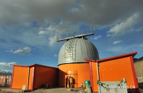 Photo taken on May 7, 2011 shows the astronomical observation station equipped with the millimeter telescope, in Yangbajain, southwest China's Tibet Autonomous Region. Installed at an altitude of 4,300 meters, the KOSMA millimeter telescope, a project cooperated by China and Germany, enters the phase of debug recently. It is one of the most advanced astronomical observation facilities to observe the outer space. [Chen Haining/Xinhua]