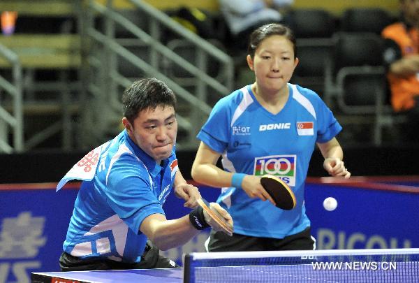 Gao Ning (L) and Li Jiawei from Singapore compete in the first round match of mixed doubles against El-Sayed Lashin and Sara Hassan of Egypt in the 2011 World Table Tennis Championships (WTTC) in Rotterdam, the Netherlands, May 9, 2011. Gao Ning and Li Jiawei won with 4:0. [Wu Wei/Xinhua]