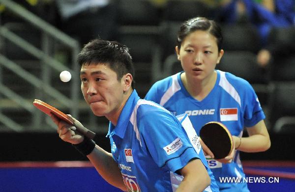 Gao Ning (L) and Li Jiawei from Singapore compete in the first round match of mixed doubles against El-Sayed Lashin and Sara Hassan of Egypt in the 2011 World Table Tennis Championships (WTTC) in Rotterdam, the Netherlands, May 9, 2011. Gao Ning and Li Jiawei won with 4:0. [Wu Wei/Xinhua]