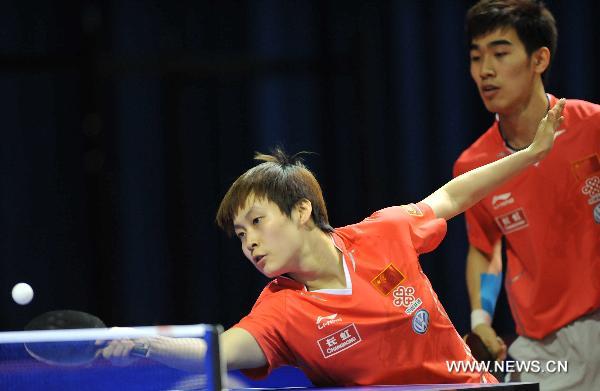 Yan An (R) and Feng Yalan from China compete in the first round match of mixed doubles against Robert Floras and Antonina Szymanska of Poland in the 2011 World Table Tennis Championships (WTTC) in Rotterdam, the Netherlands, May 9, 2011. Yan An and Feng Yalan won with 4:2. [Wu We/Xinhua]