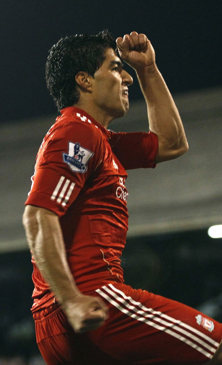 Liverpool's Luis Suarez celebrates his goal against Fulham during their English Premier League soccer match at Craven Cottage in London May 9, 2011. Liverpool improved its chances of finishing fifth in the Premier League and earning a spot in next season's Europa League by winning 5-2 at Fulham on Monday. [Xinhua/Reuters]