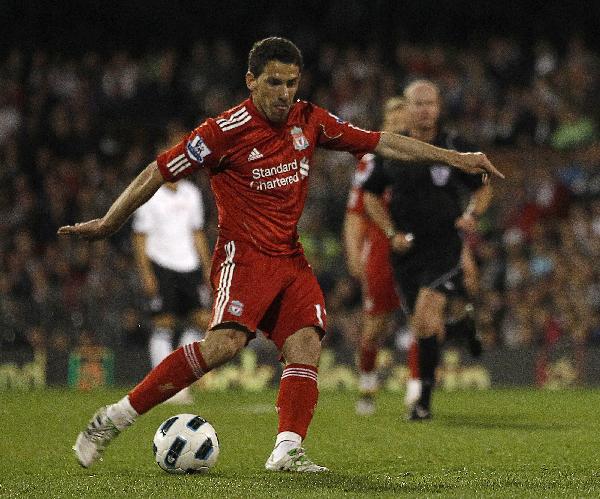 Liverpool's Maxi Rodriguez shoots and scores his 3rd goal against Fulham during their English Premier League soccer match at Craven Cottage in London May 9, 2011. Liverpool improved its chances of finishing fifth in the Premier League and earning a spot in next season's Europa League by winning 5-2 at Fulham on Monday. [Xinhua/Reuters]